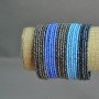 Pulsera de cuentas con broche en tonos morado-azulado-gris
