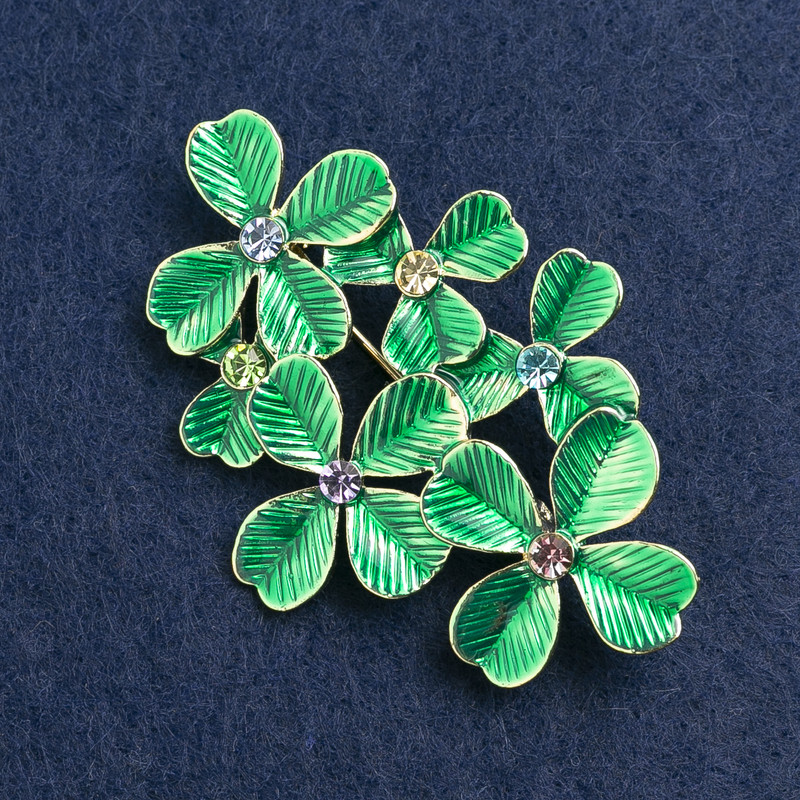 Broche Hojas verdes con strass y metal dorado
